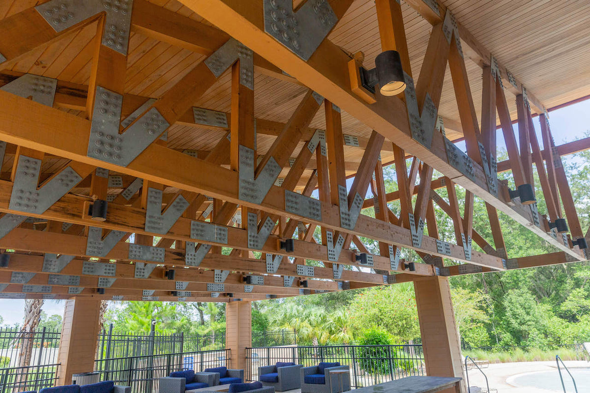 Looking along the underside of the pavilion's trusses and their galvanized plates