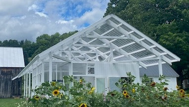 Painted plates on a greenhouse