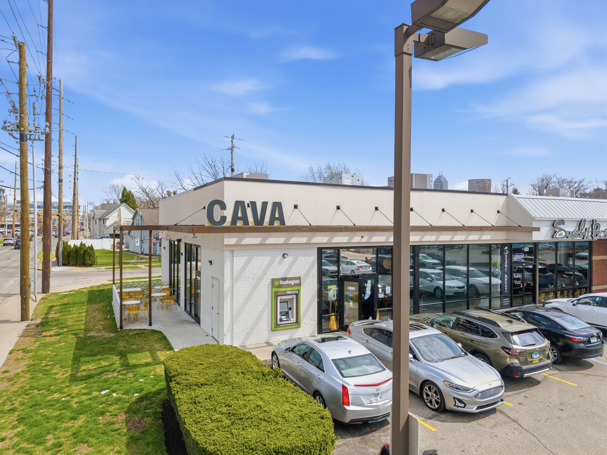 Indianapolis CAVA storefront with a timber awning and patio pergola supported by steel tie rods