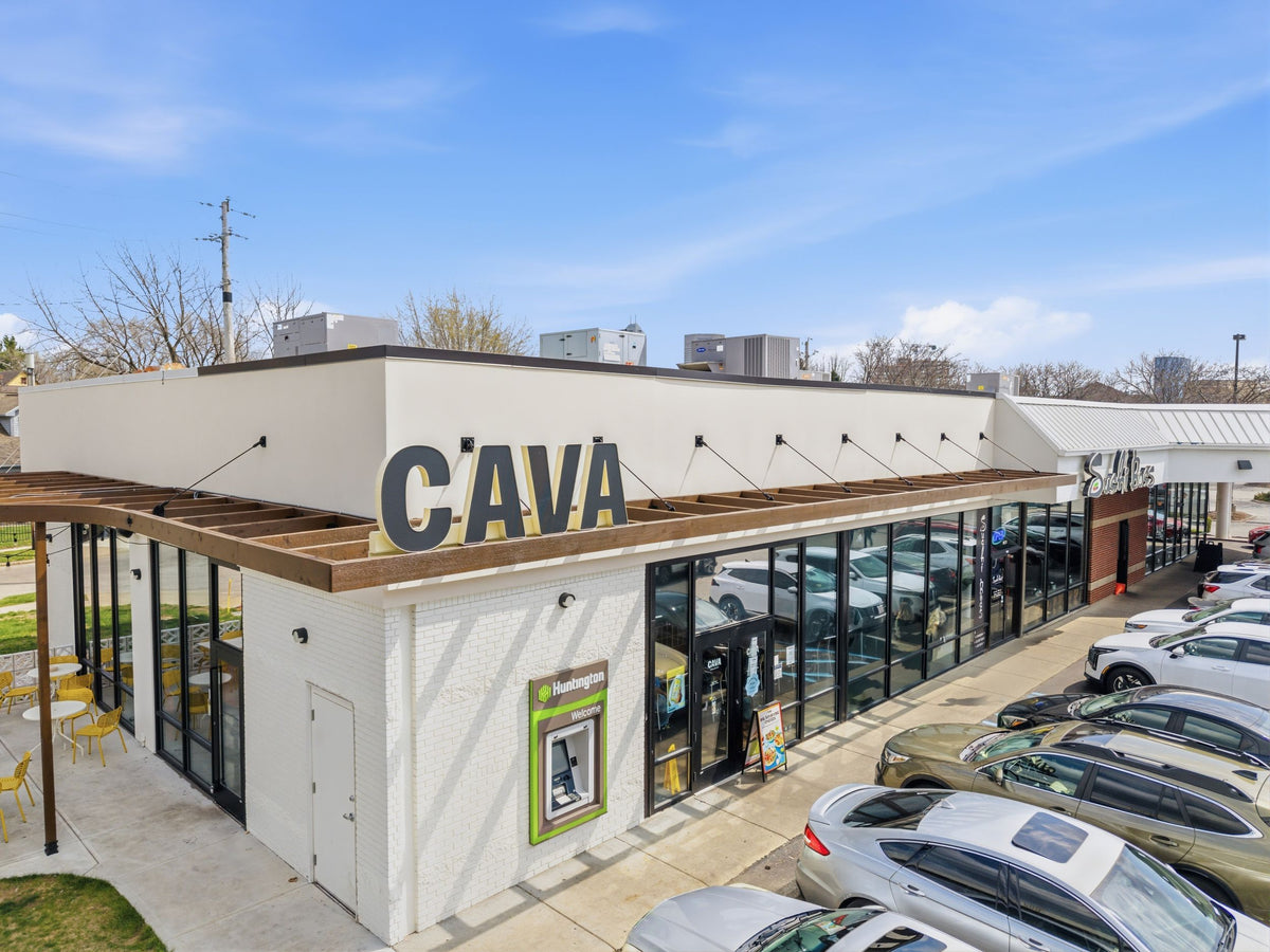 Timber awning at the Indianapolis CAVA, hung from the parapet on black steel tie rods