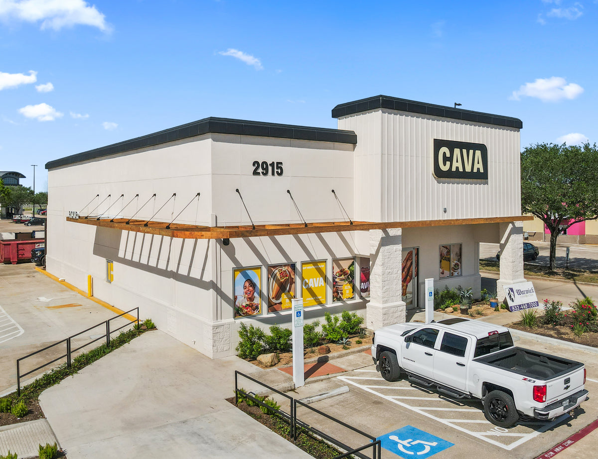 CAVA restaurant in League City, Texas, with a timber awning hung from the wall on black steel tie rods