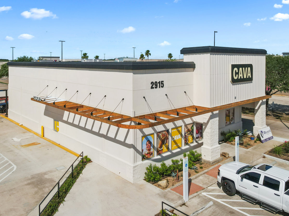 Aerial view of the League City CAVA and its wraparound timber awning, held by a row of black steel tie rods