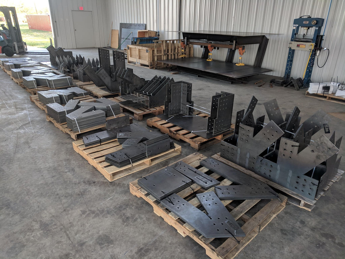 Steel plate components for the project on pallets in the Timberplates shop