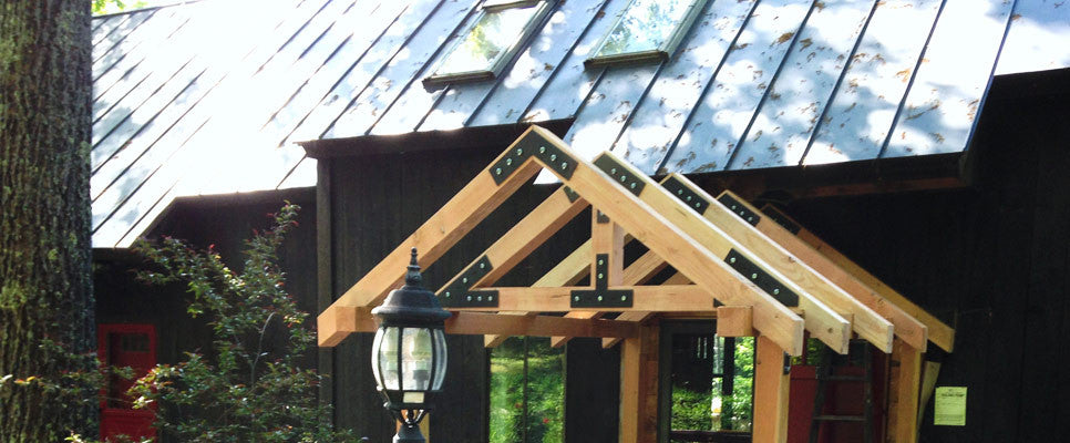 Porch frame showing V, N, T, and W Timber Truss Plates from our Taiga line